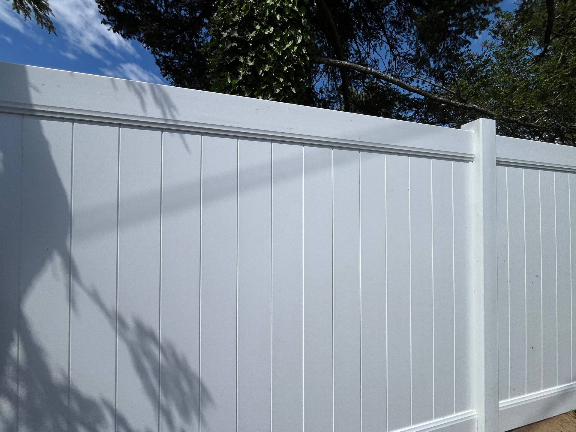 Residential white vinyl fence panel installation in Burlington County NJ