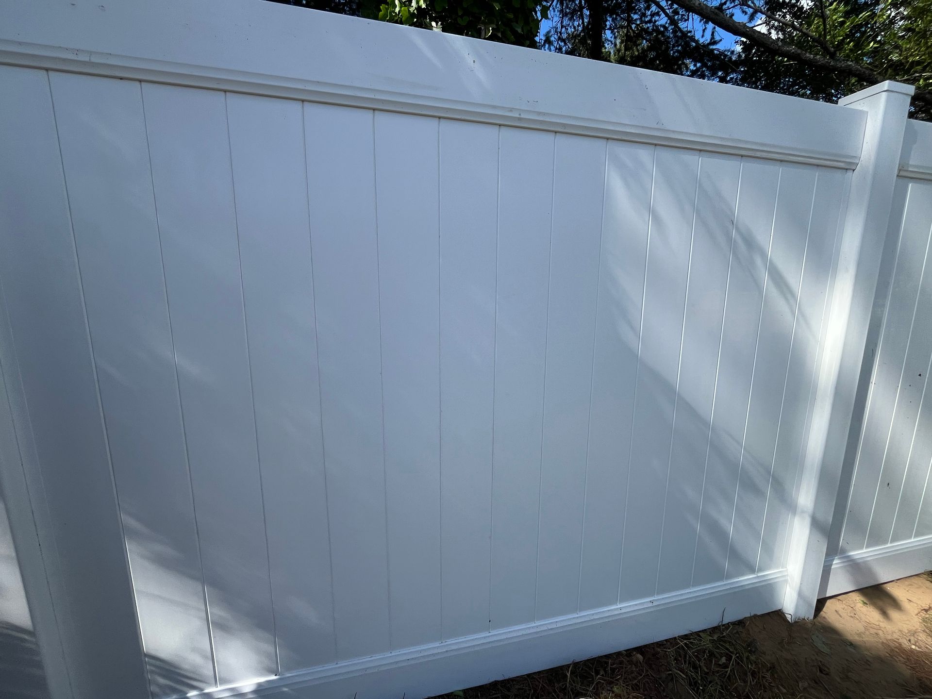 White vinyl fence panel close-up installation in Burlington County NJ