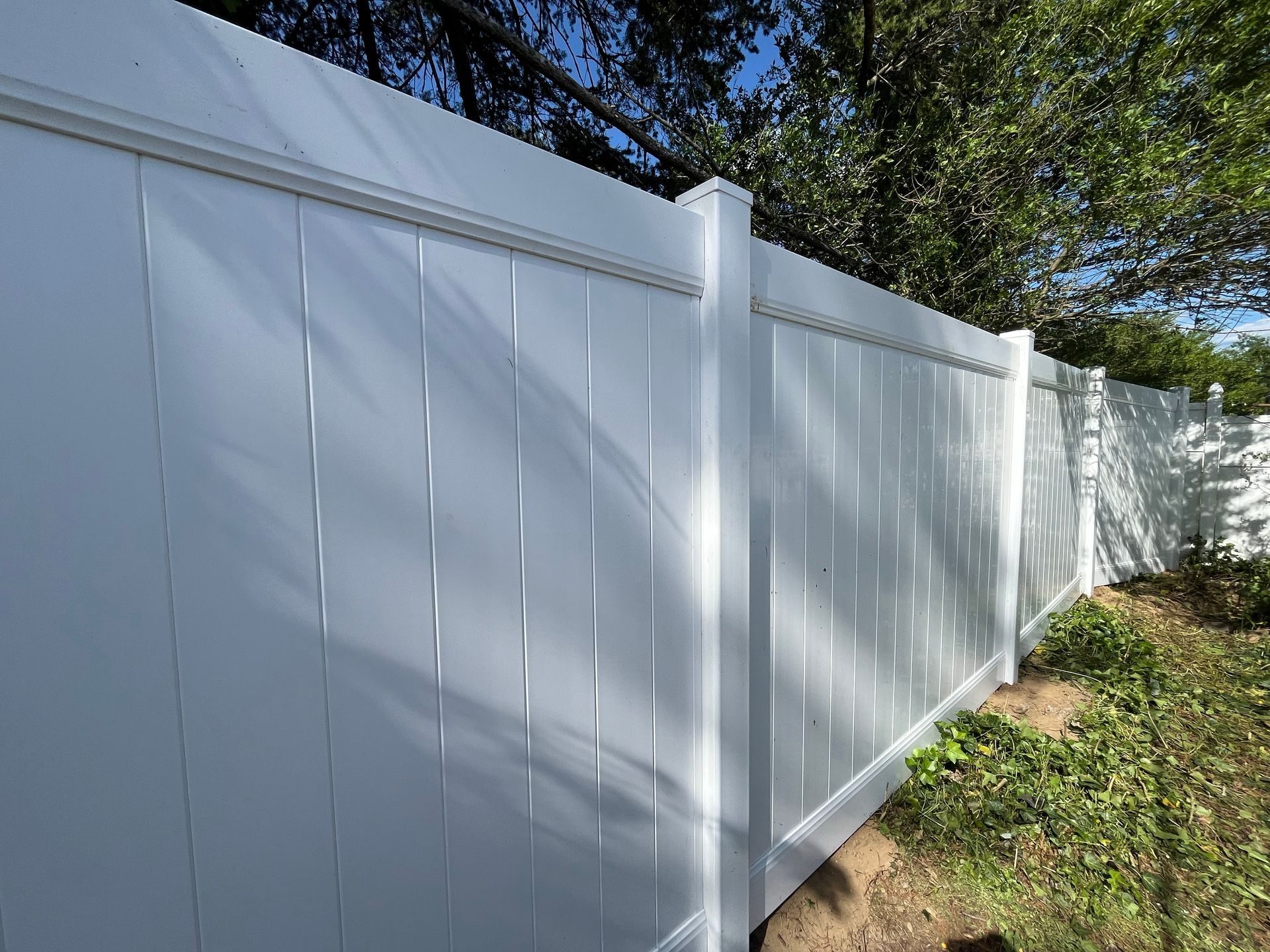 Finished backyard white vinyl fence installation in Burlington County NJ
