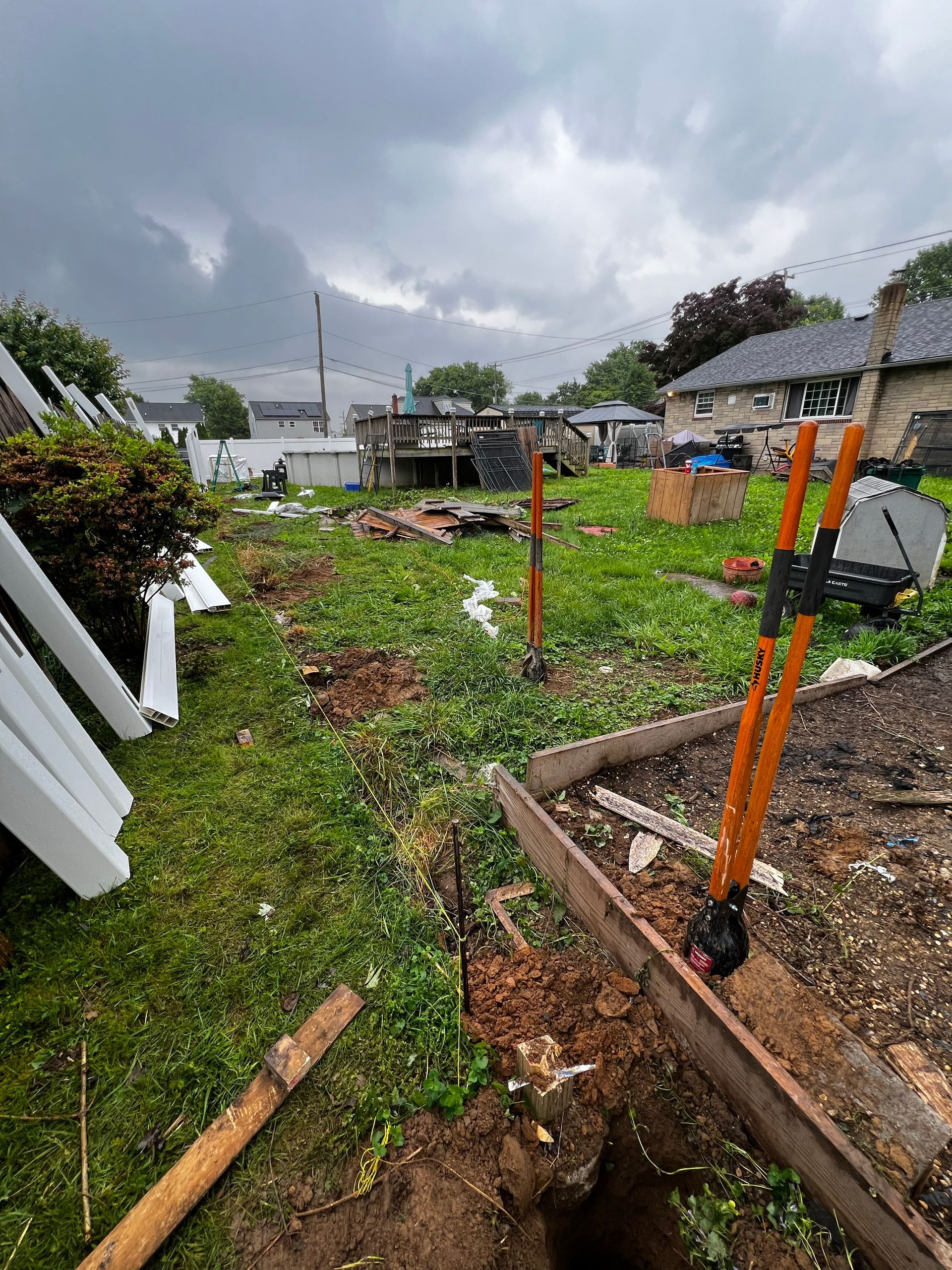 Fence line preparation before vinyl fence installation in Burlington County NJ