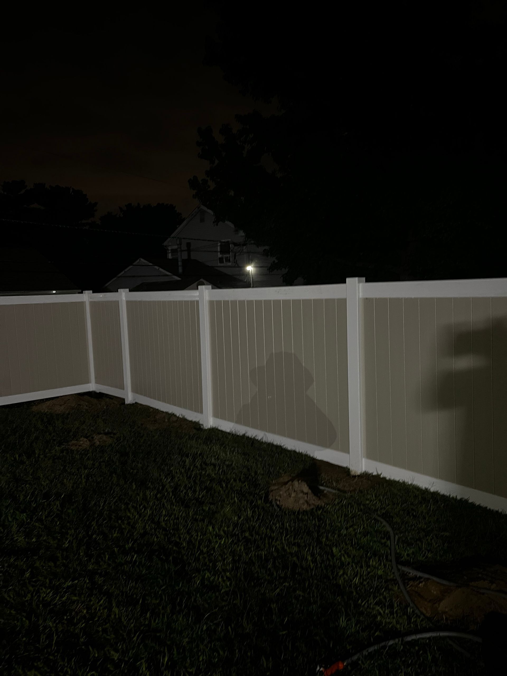 Finished white vinyl fence line installation in Burlington County NJ