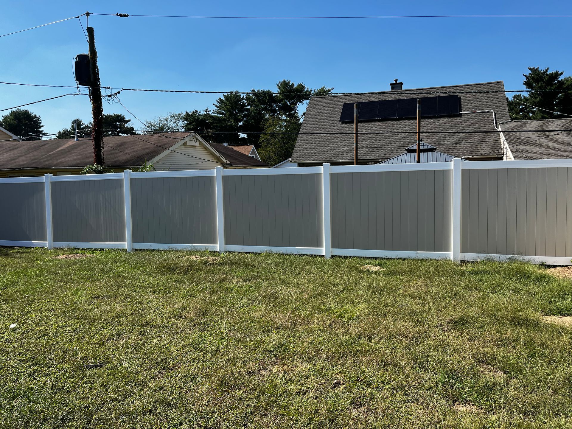 Wide yard white vinyl privacy fence installation in Burlington County NJ