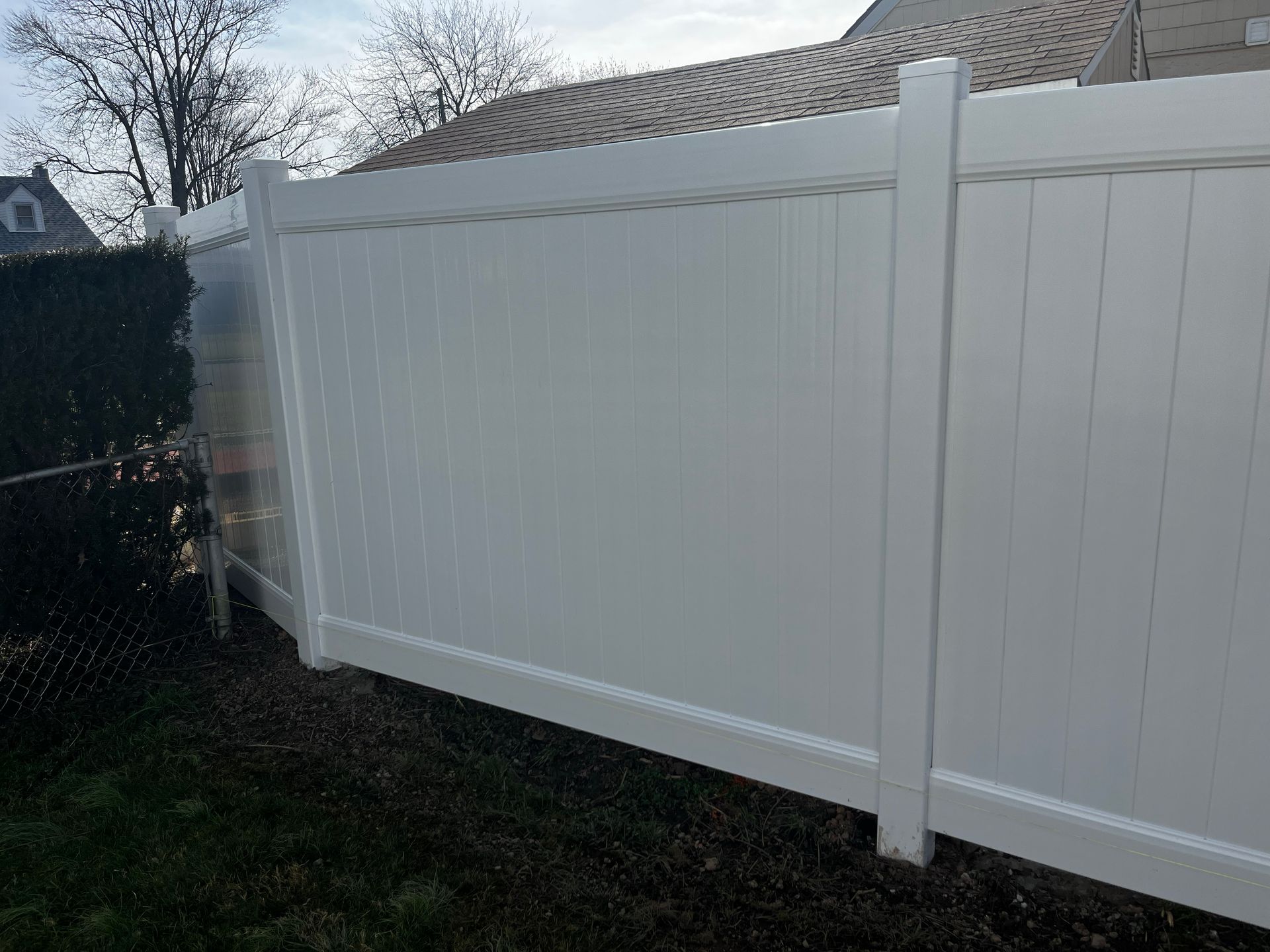 Completed white vinyl fence panel replacement in Burlington County NJ