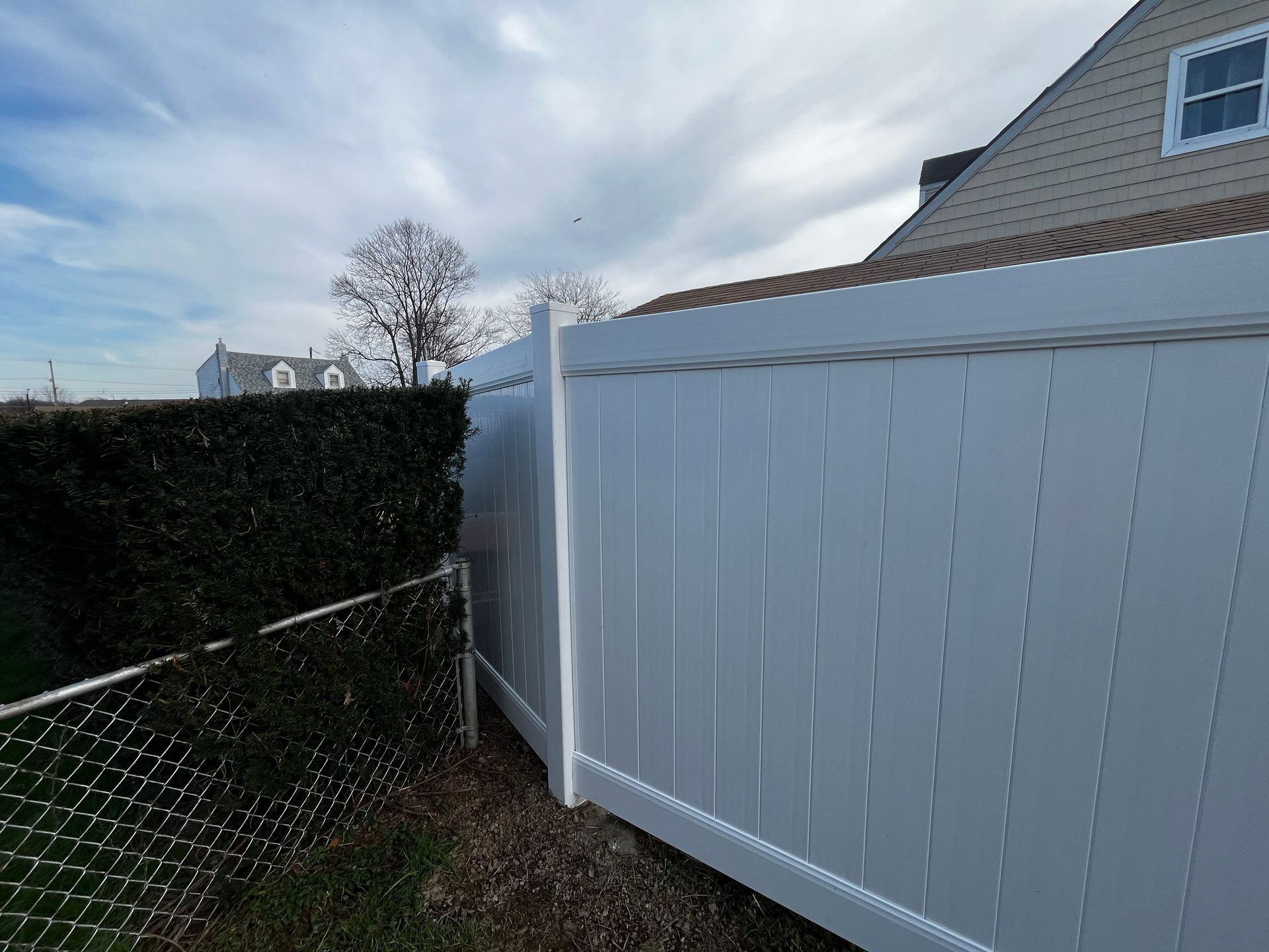 Corner white vinyl privacy fence installation in Burlington County NJ
