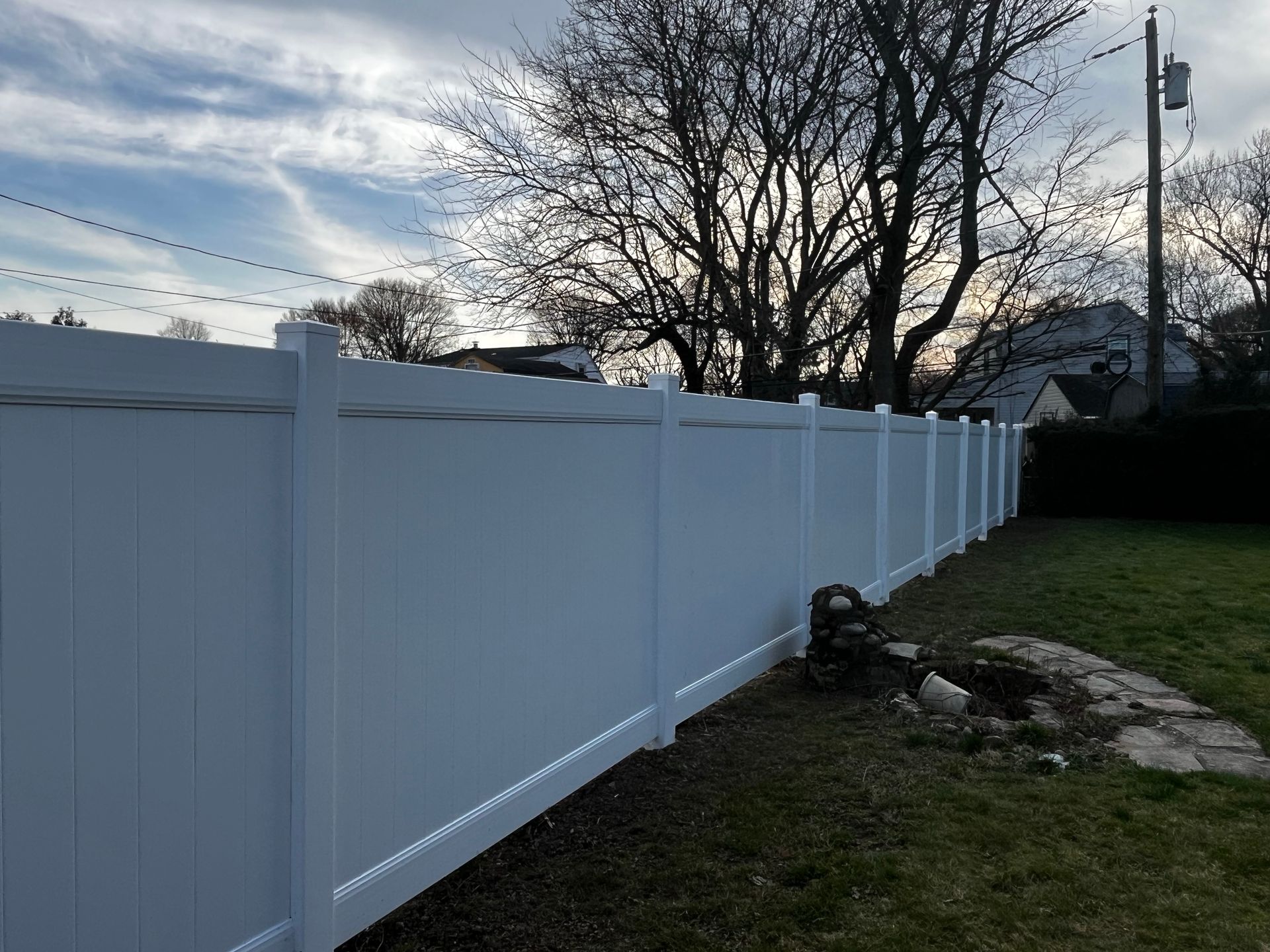 Long run white vinyl backyard fence project in Burlington County NJ