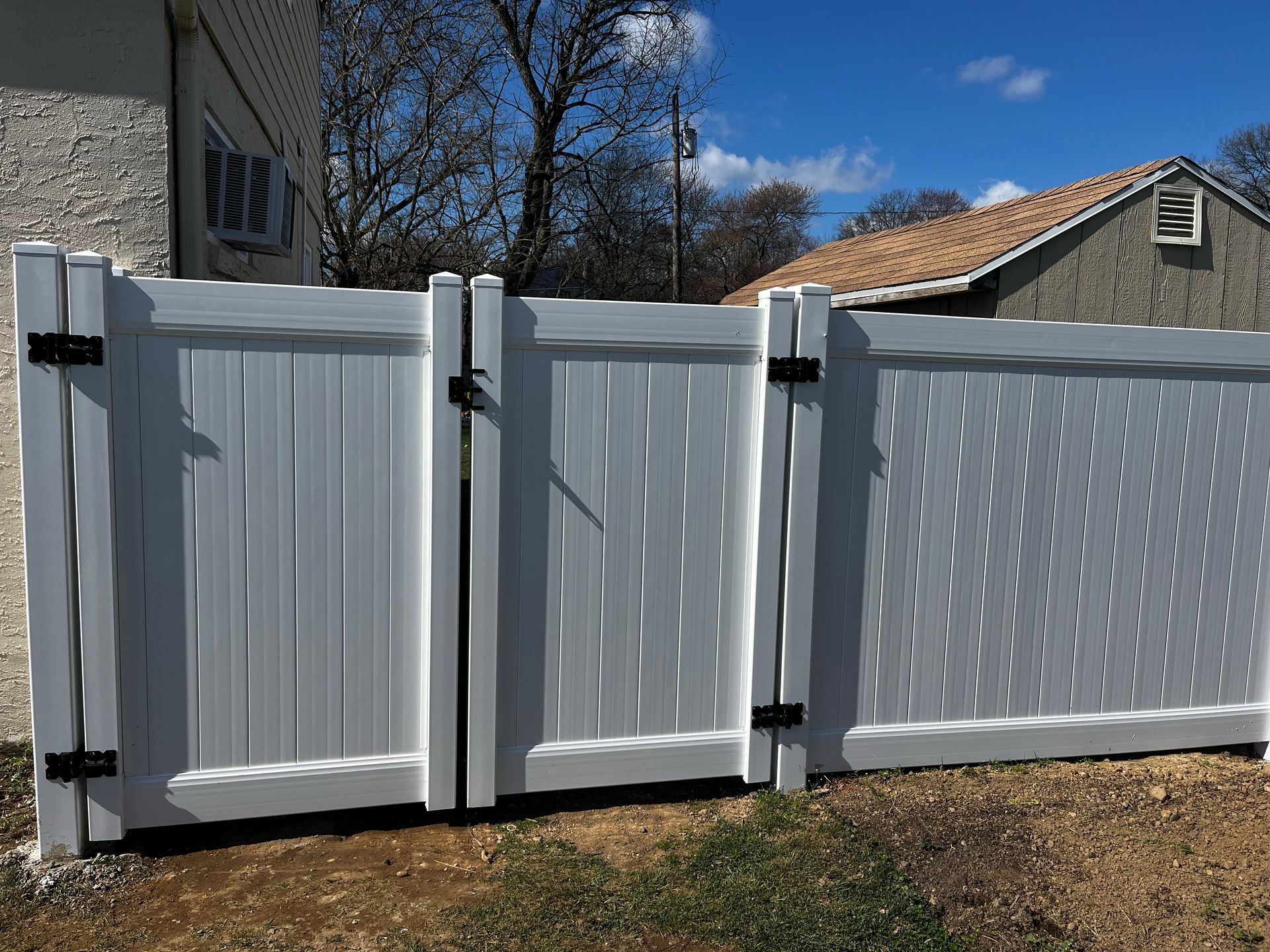 Custom double gate white vinyl fence installation in Burlington County NJ