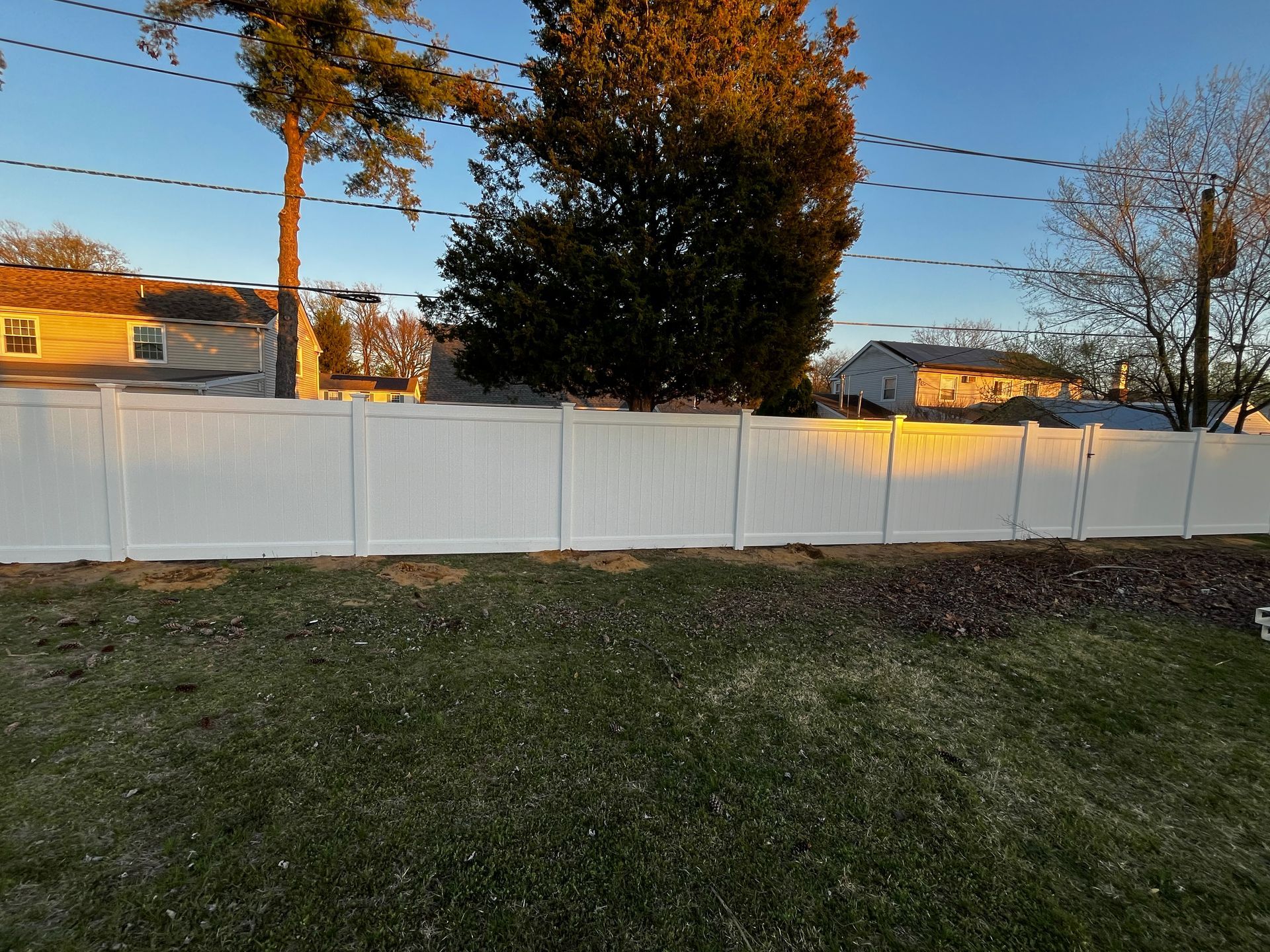 Wide backyard white vinyl fence installation in Burlington County NJ