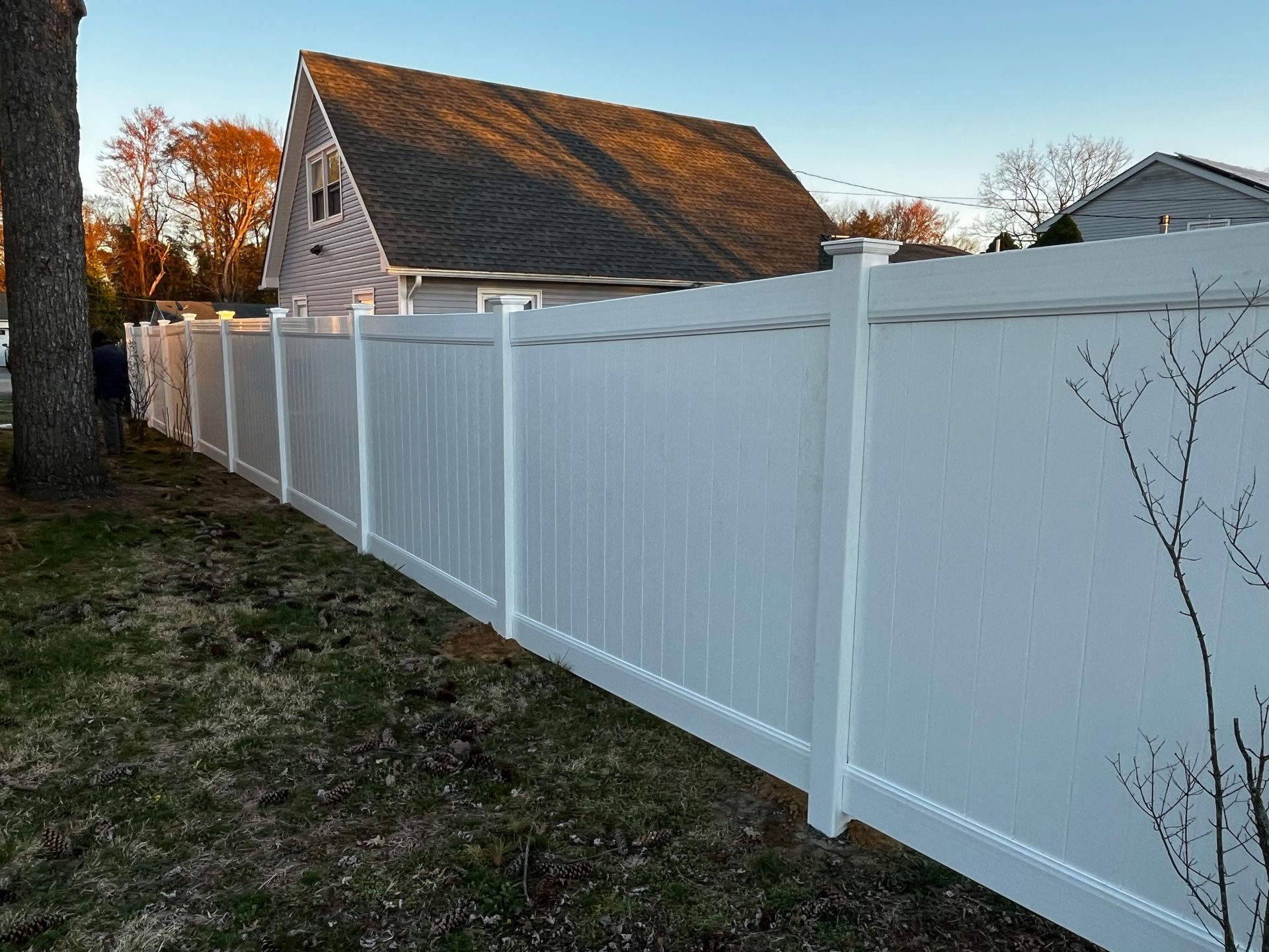 Long white vinyl privacy fence installation in Burlington County NJ