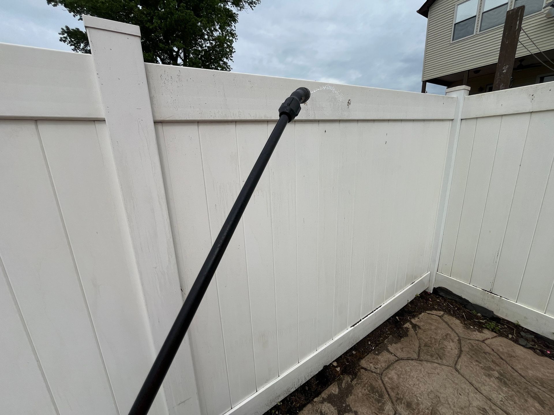 Close-up white vinyl privacy fence corner detail in Burlington County NJ