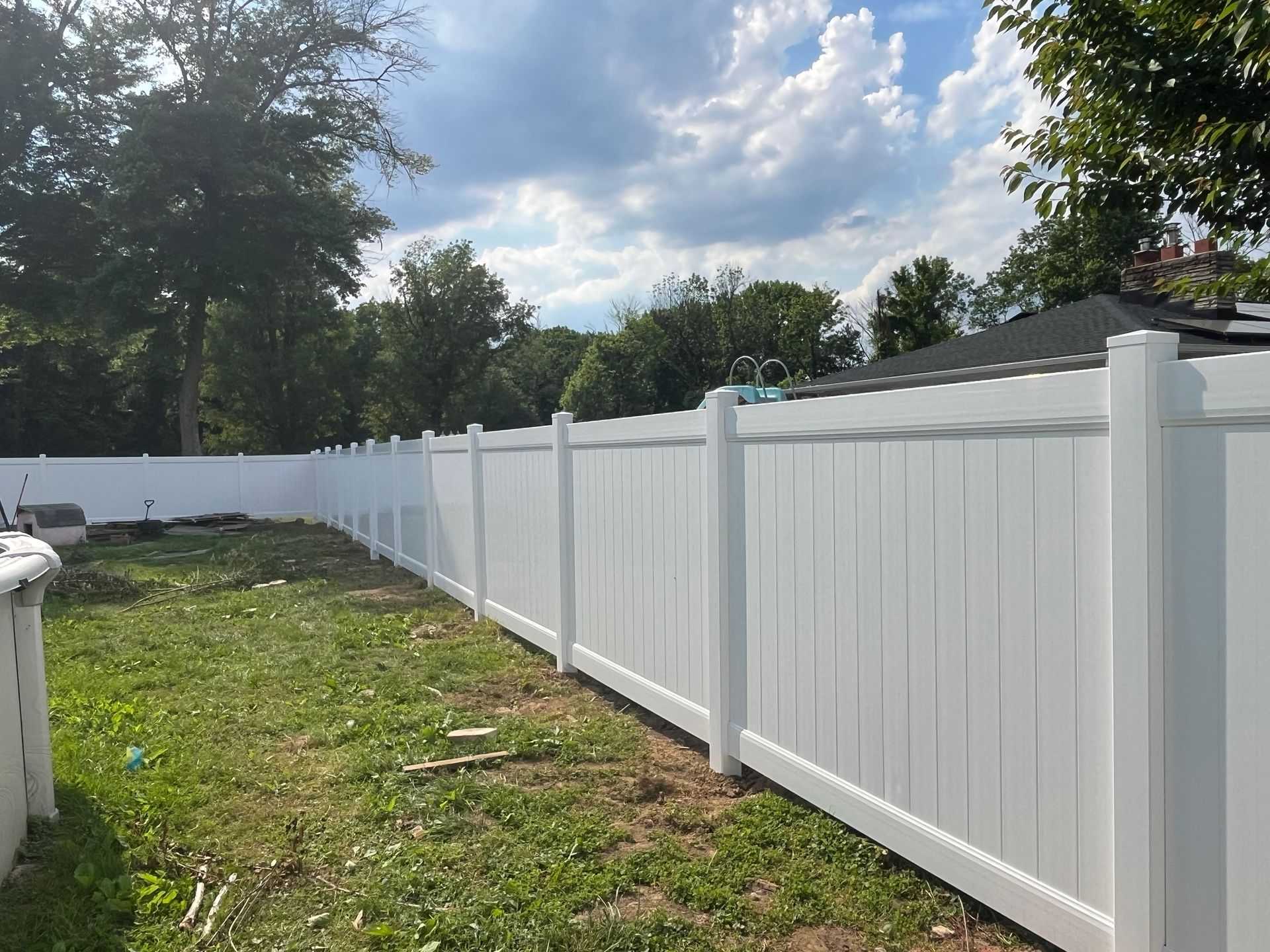 Wide backyard vinyl fence installation in Burlington County NJ