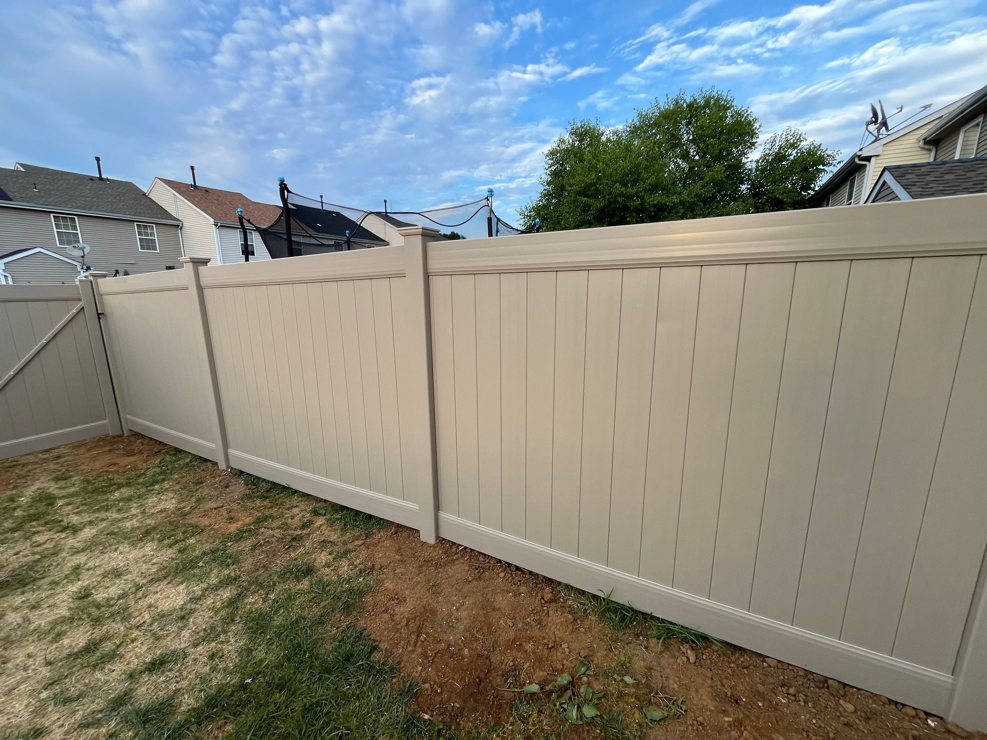 Completed white vinyl backyard fence project in Burlington County NJ