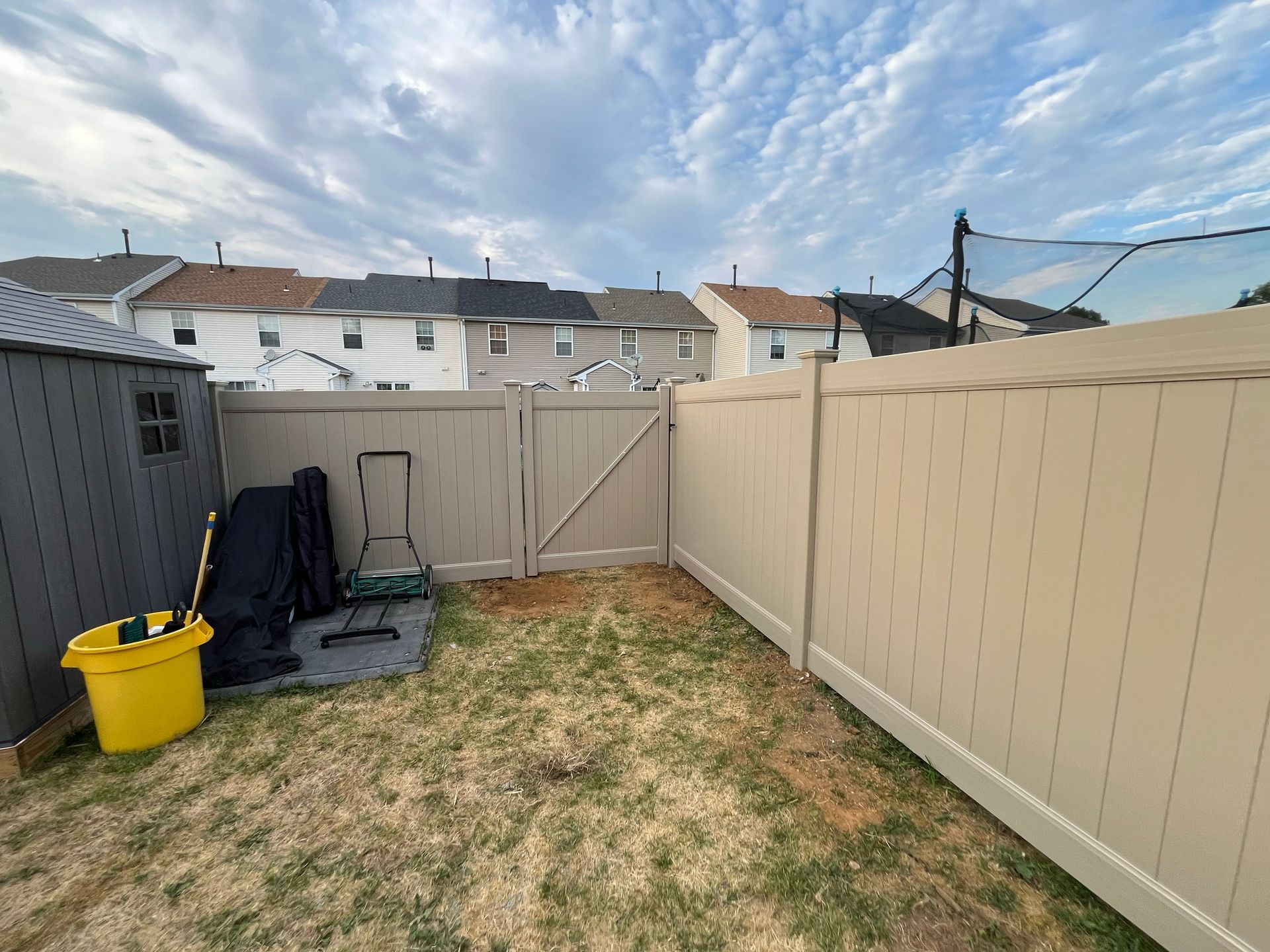 Tan vinyl privacy fence and gate installation in Burlington County NJ