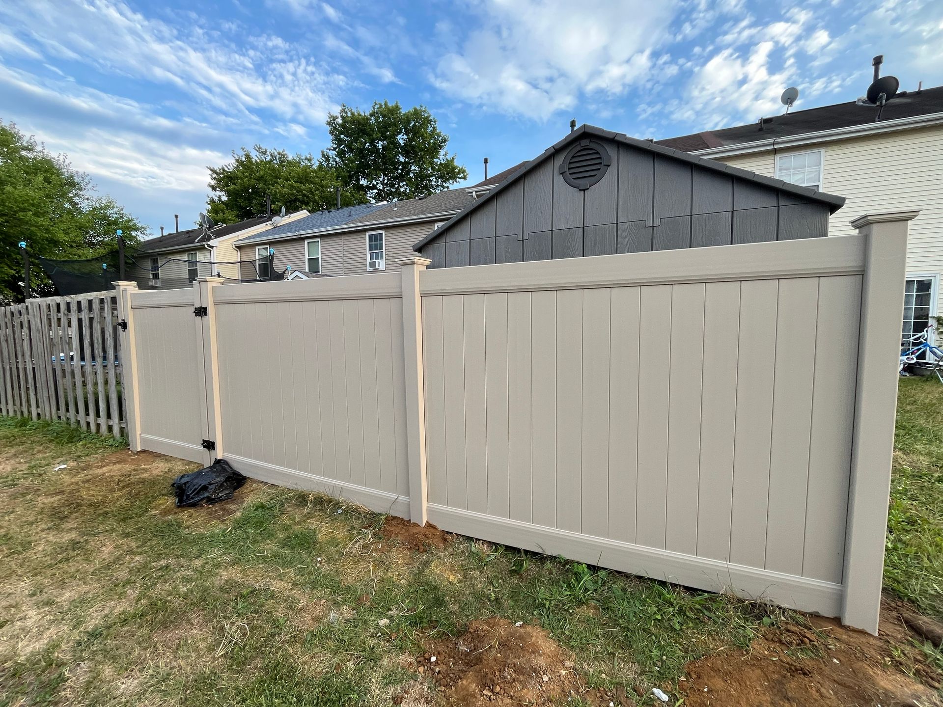 Tan vinyl fence replacement beside home in Burlington County NJ