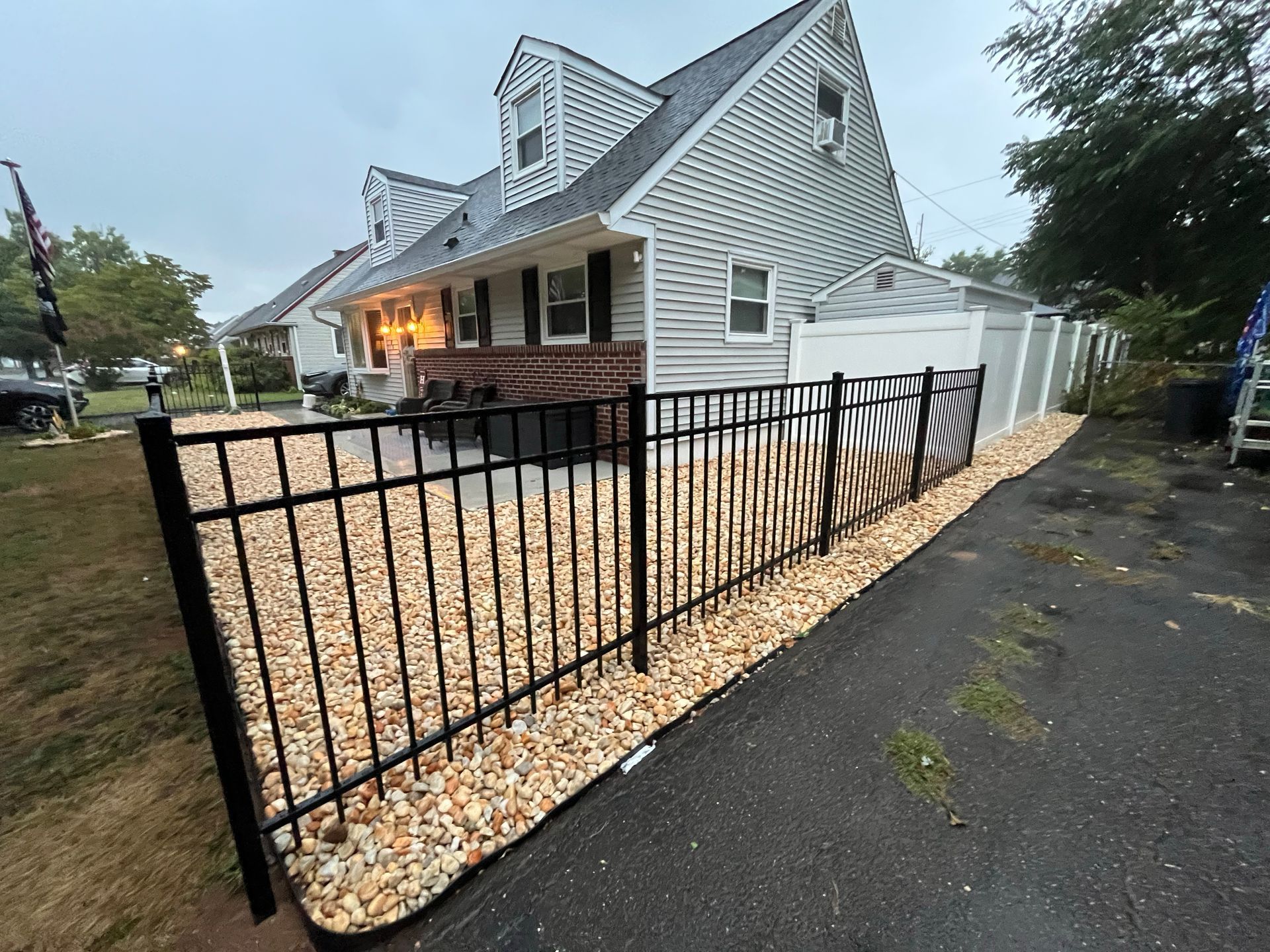 Black aluminum fence installation at residential property in Burlington County NJ