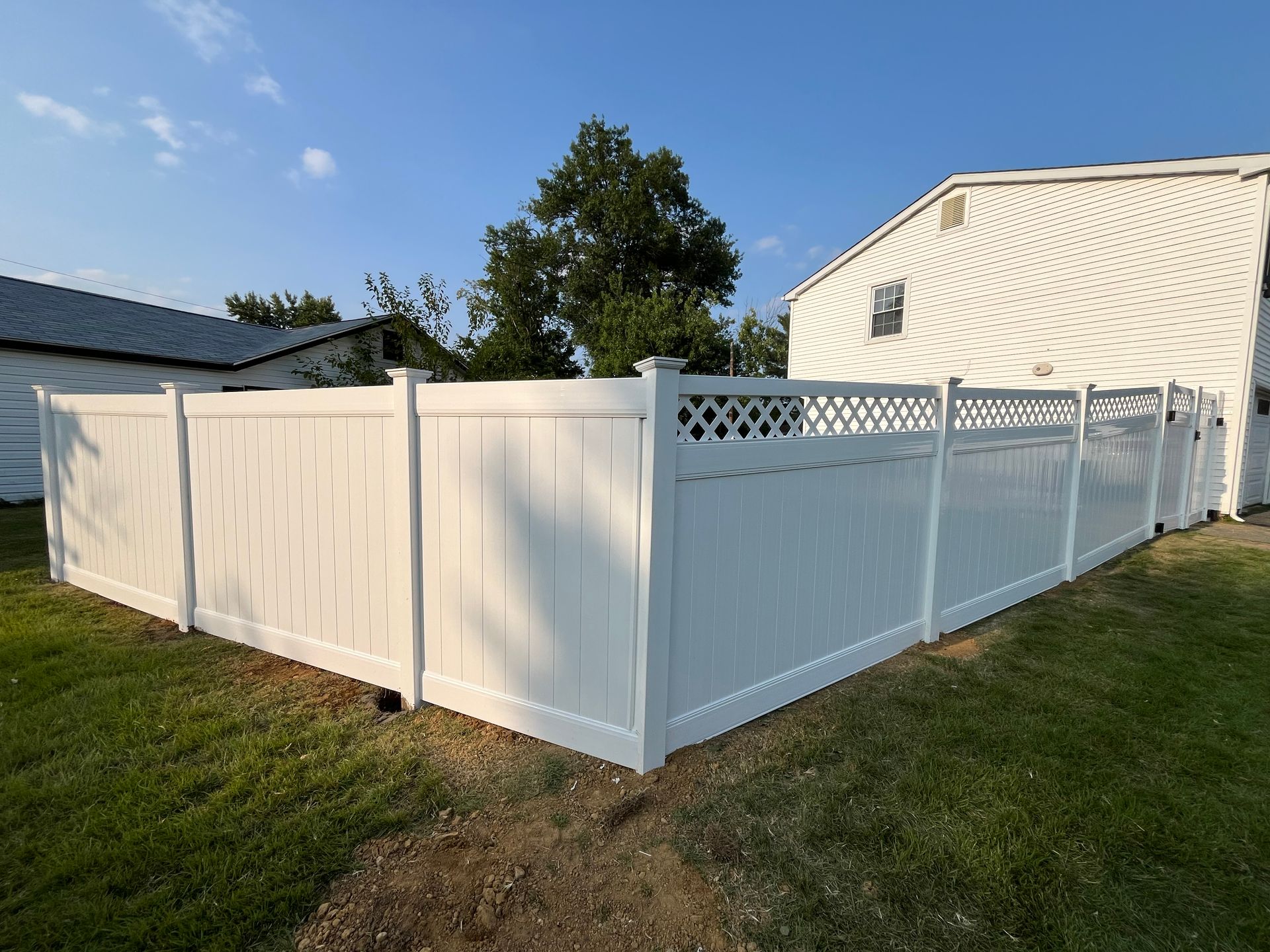 White vinyl lattice top fence corner installation in Burlington County NJ