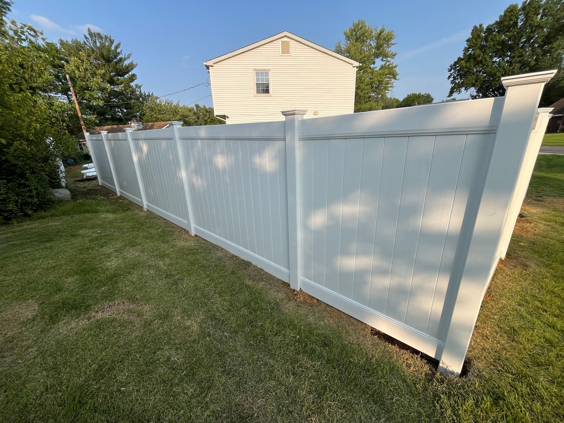 Long white lattice top vinyl fence project in Burlington County NJ