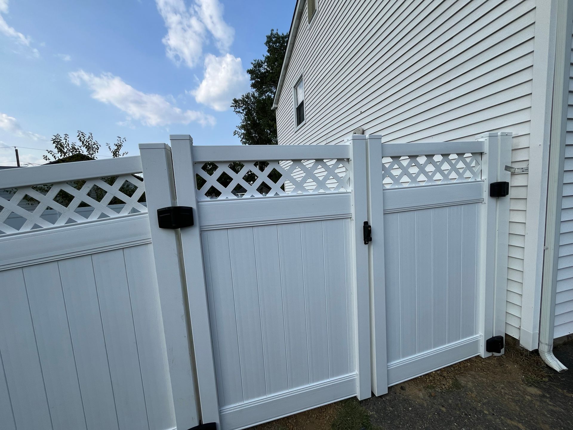 White vinyl lattice top fence gate installation in Burlington County NJ
