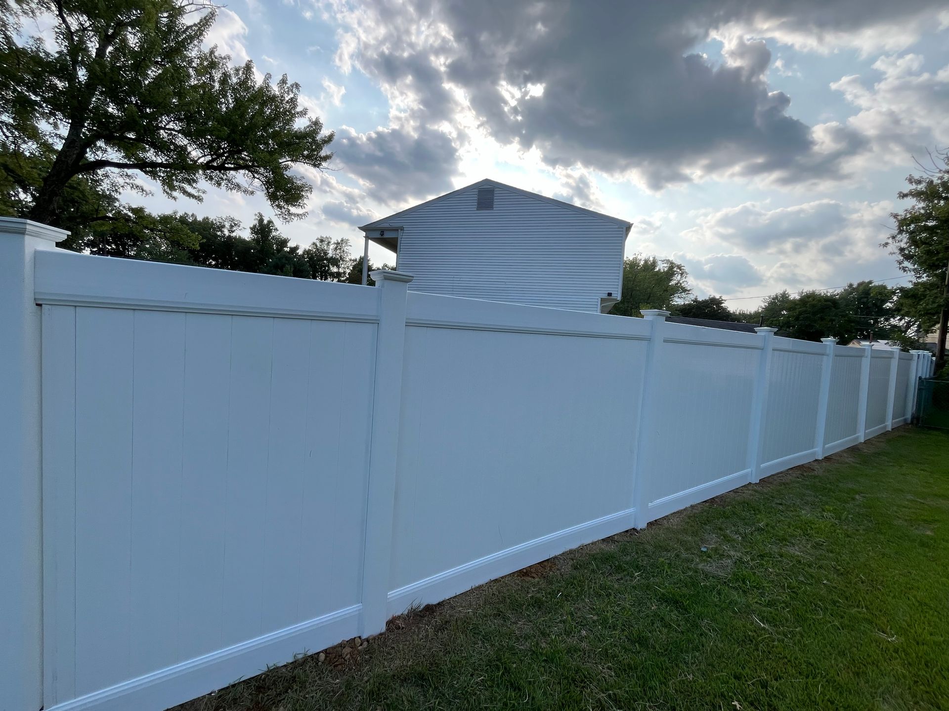 Decorative white lattice top privacy fence line in Burlington County NJ