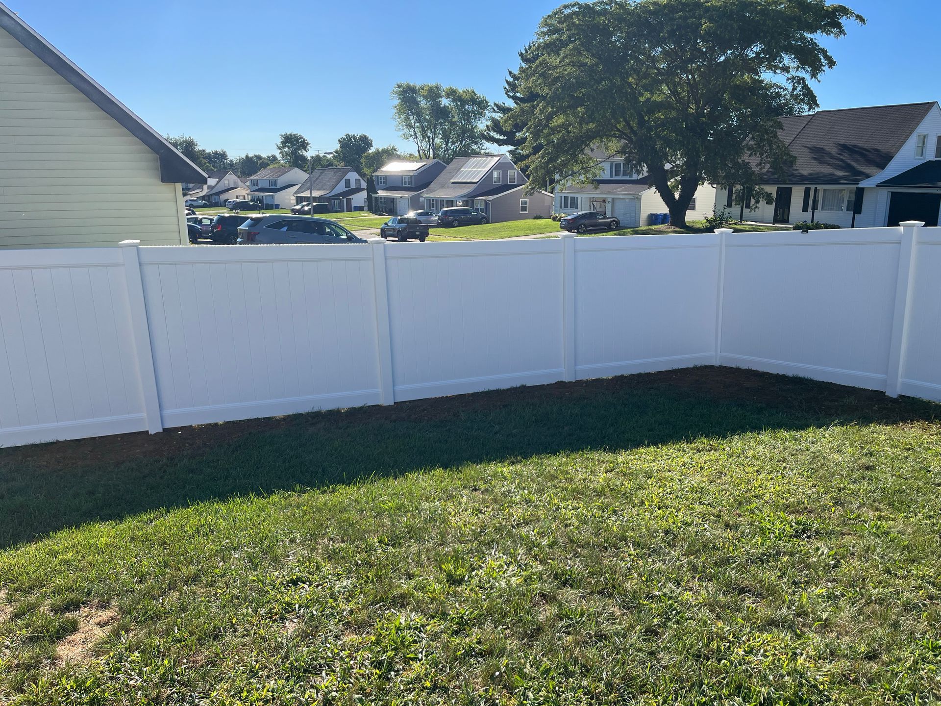 White vinyl backyard fence installation by J&S Fencing in Burlington County NJ