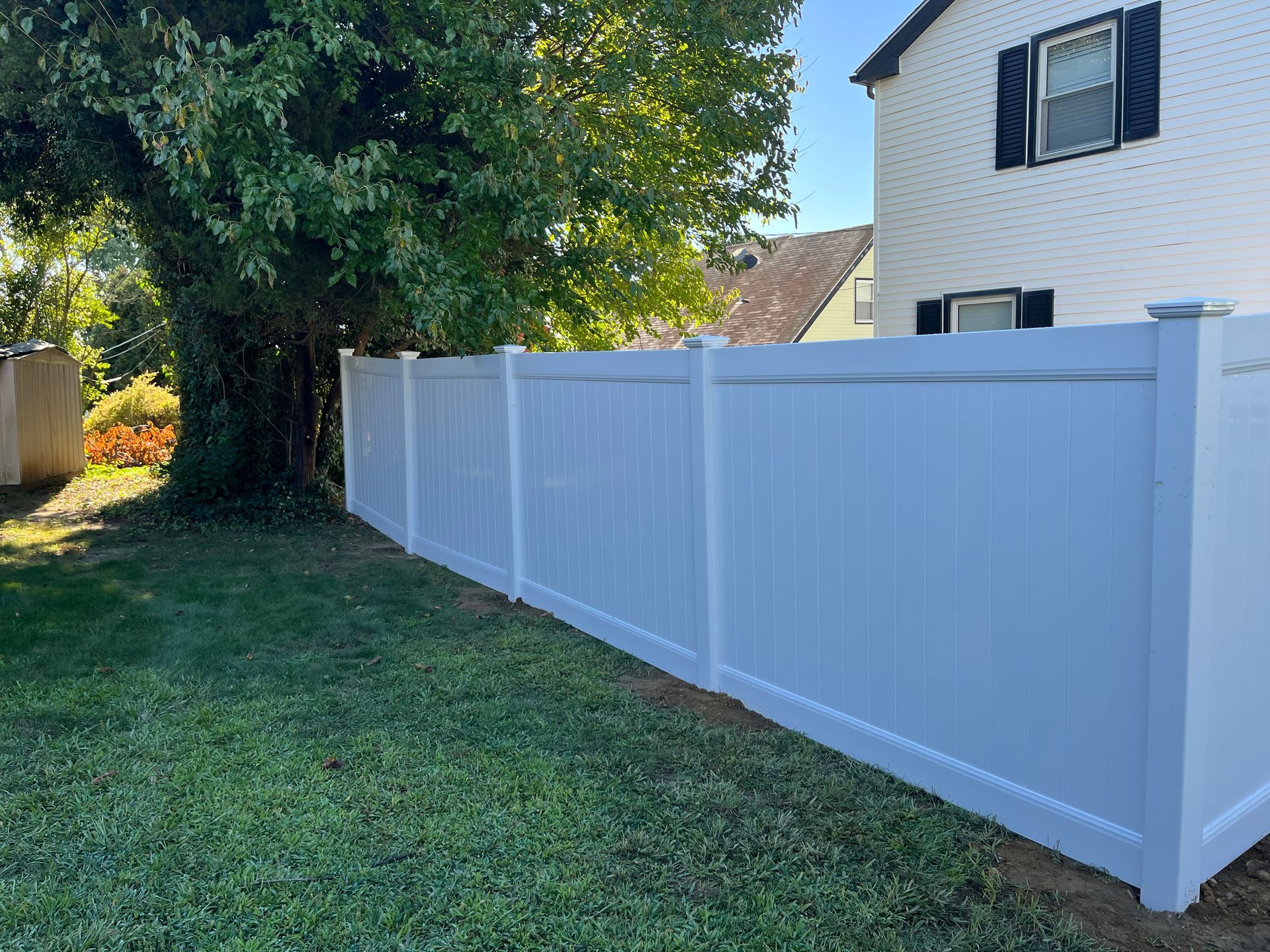 Side yard white vinyl privacy fence installation in Burlington County NJ