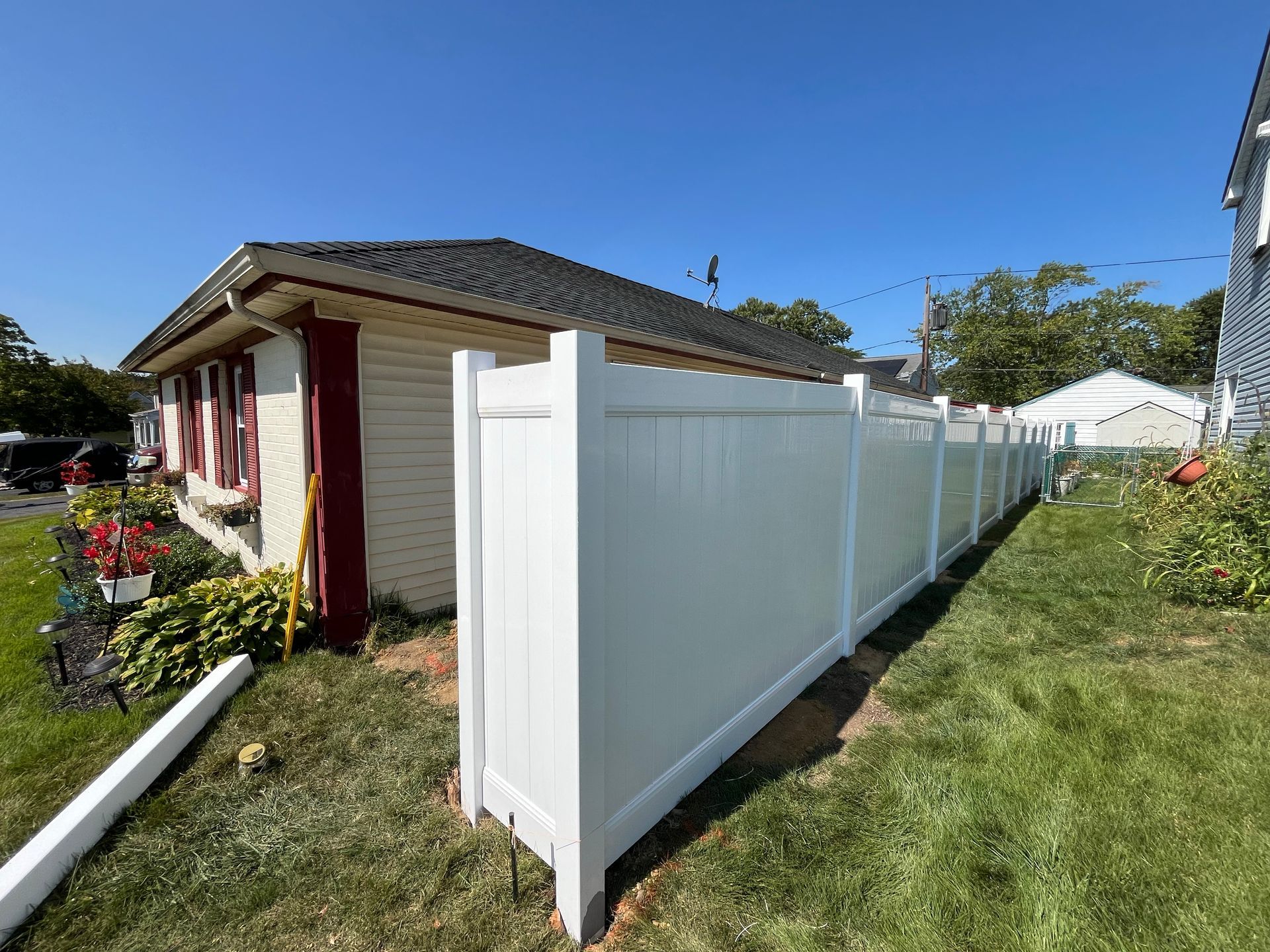 Side yard white vinyl privacy fence installation in Burlington County NJ