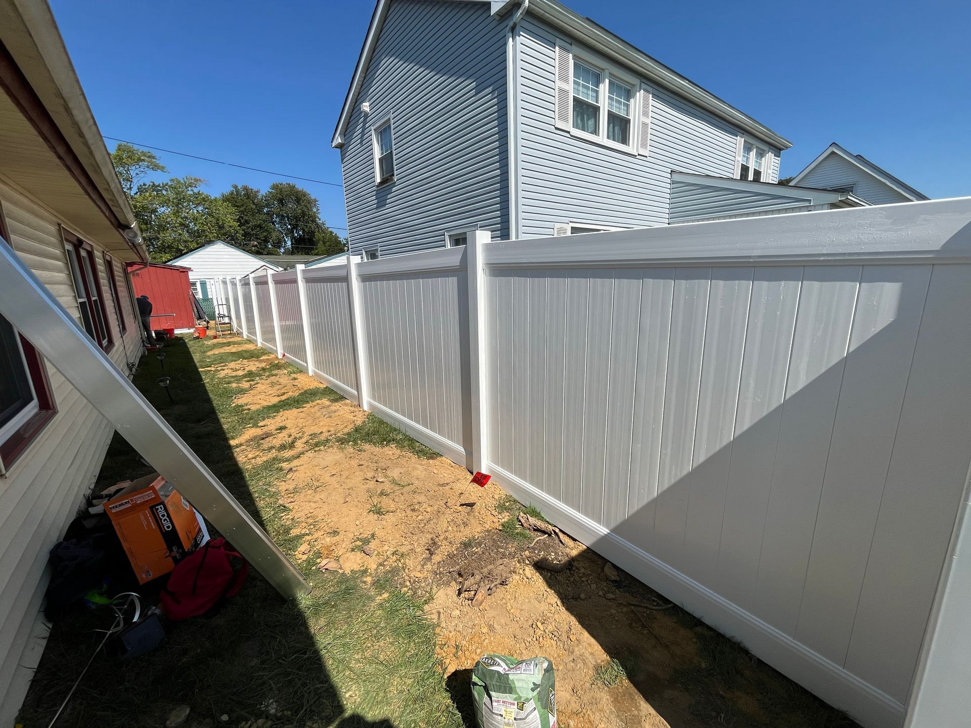 Long side yard white vinyl fence line in Burlington County NJ