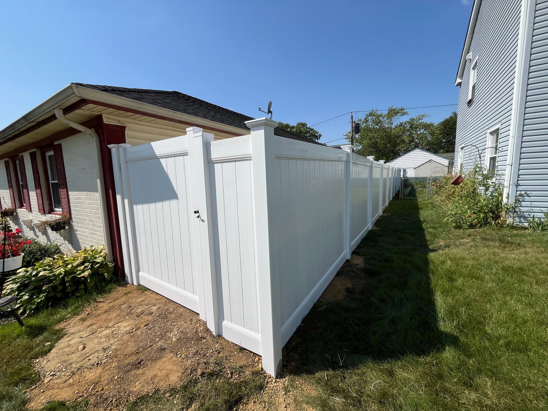 Completed white vinyl side yard fence replacement in Burlington County NJ