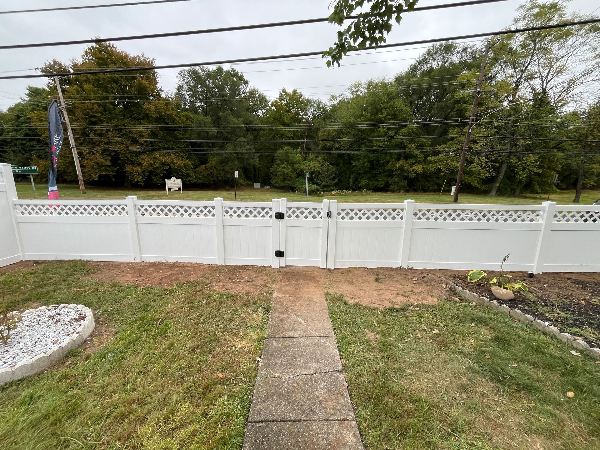 Decorative white lattice top front yard fence in Burlington County NJ