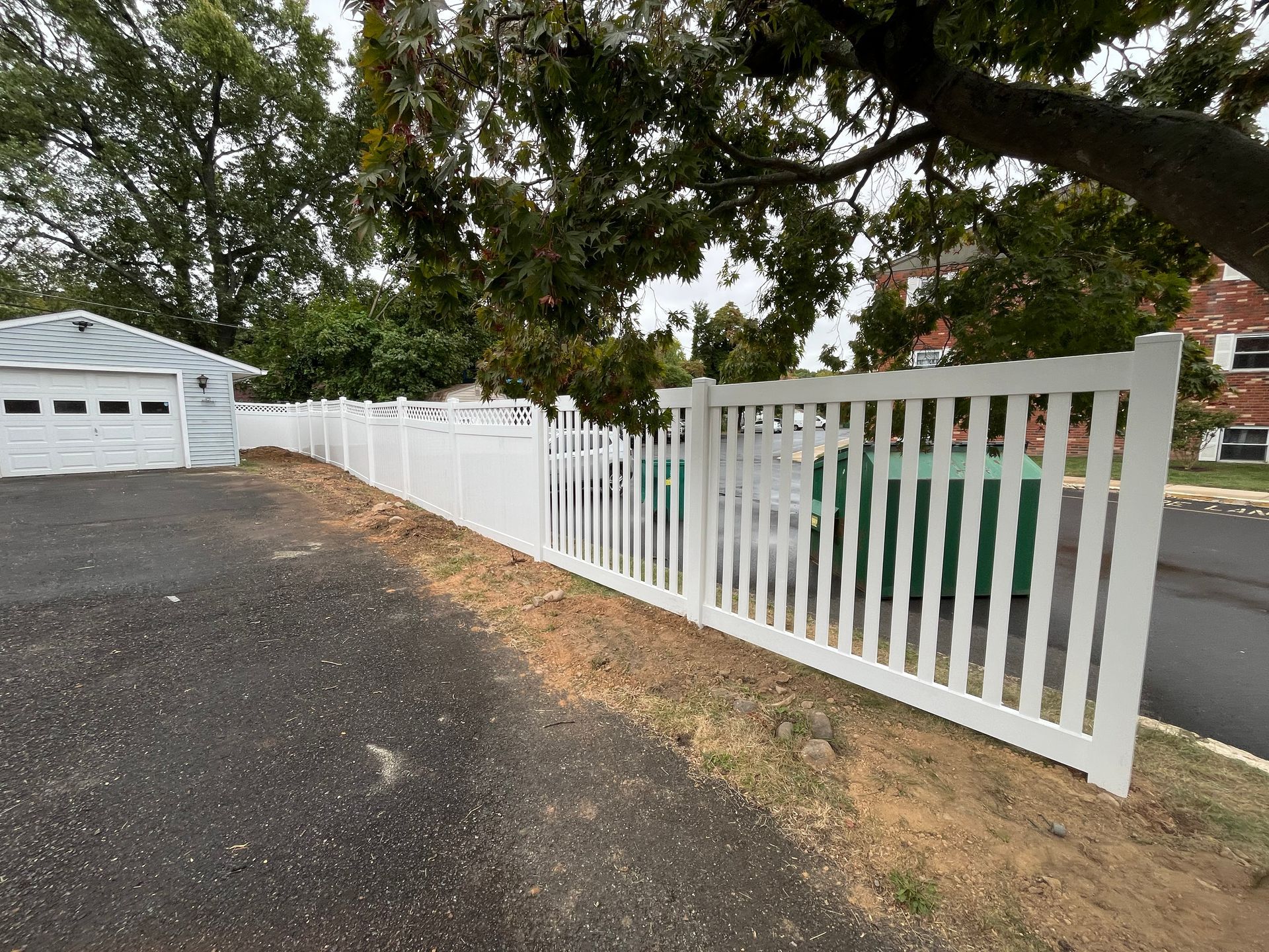 White vinyl picket driveway fence installation in Burlington County NJ
