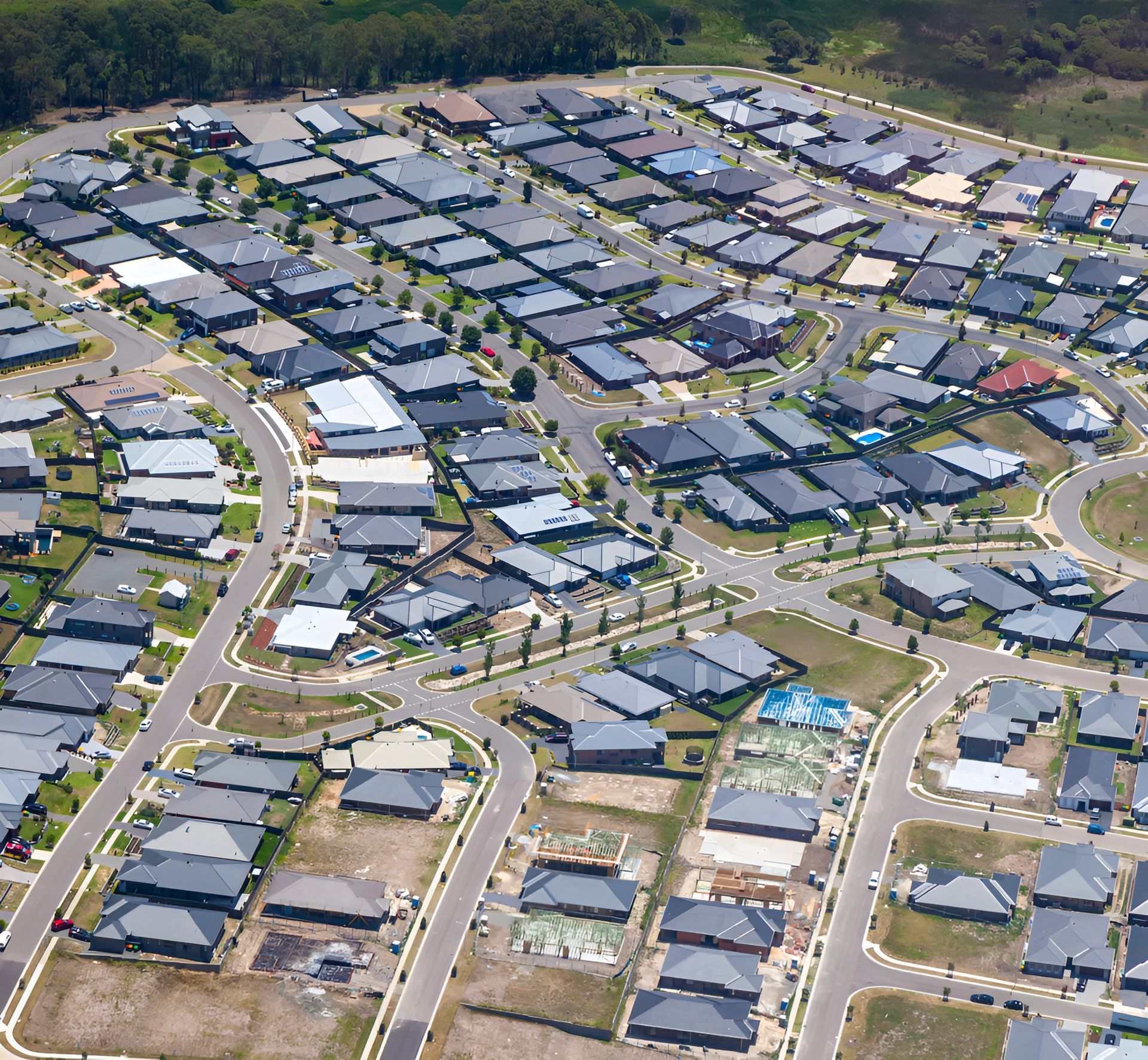 Aerial View of a Suburban Neighborhood With Rows of Houses — Darren Smith Roofing In New Lambton, NSW