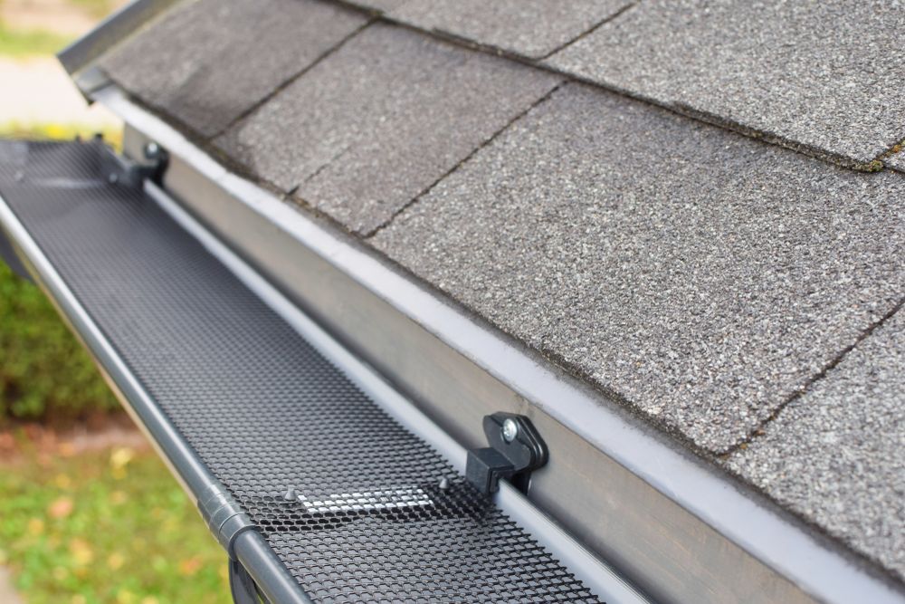 Gutter With Mesh Guard Installed on a Roof, Protecting From Debris — Darren Smith Roofing In New Lambton, NSW
