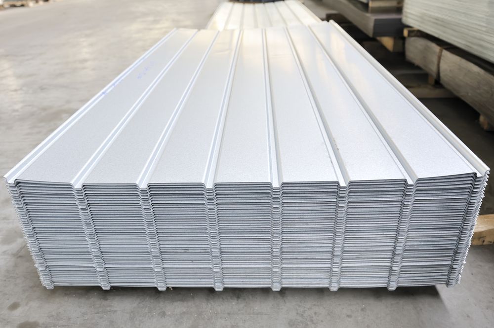 Stack of Corrugated, Silver Metal Roofing Sheets — Darren Smith Roofing In Glendale, NSW