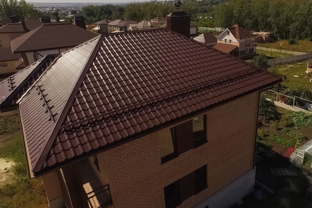 Brown Brick House With a Brown Metal Roof — Darren Smith Roofing In Merewether, NSW