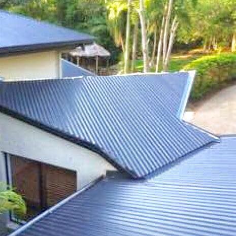 Blue Corrugated Metal Roof of a Building — Darren Smith Roofing In Glendale, NSW