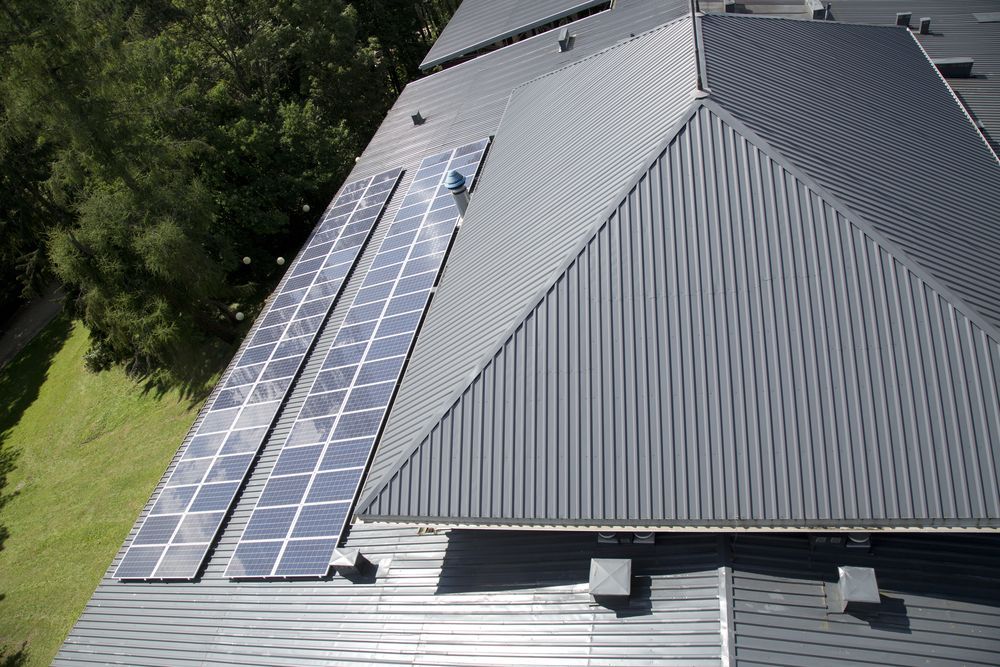 Rooftop With White Corrugated Metal — Darren Smith Roofing In Glendale, NSW