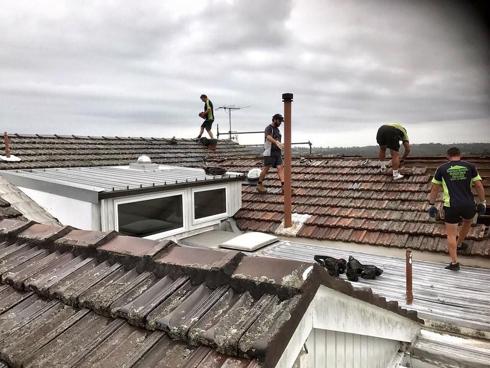 Workers on a Tiled Roof — Darren Smith Roofing In Glendale, NSW