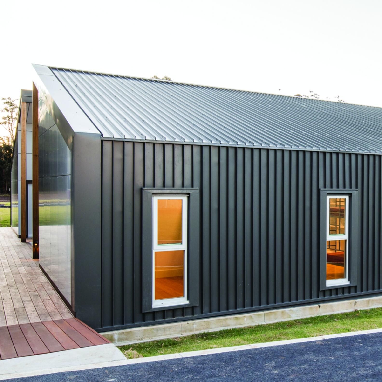 Black Metal Roof And Wall — Colorbond Roofing in Gosford, NSW