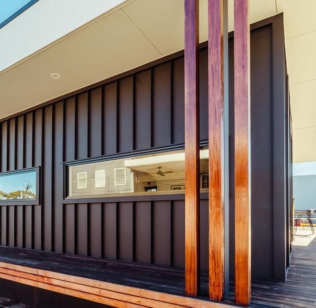 A building with a wooden railing and a window