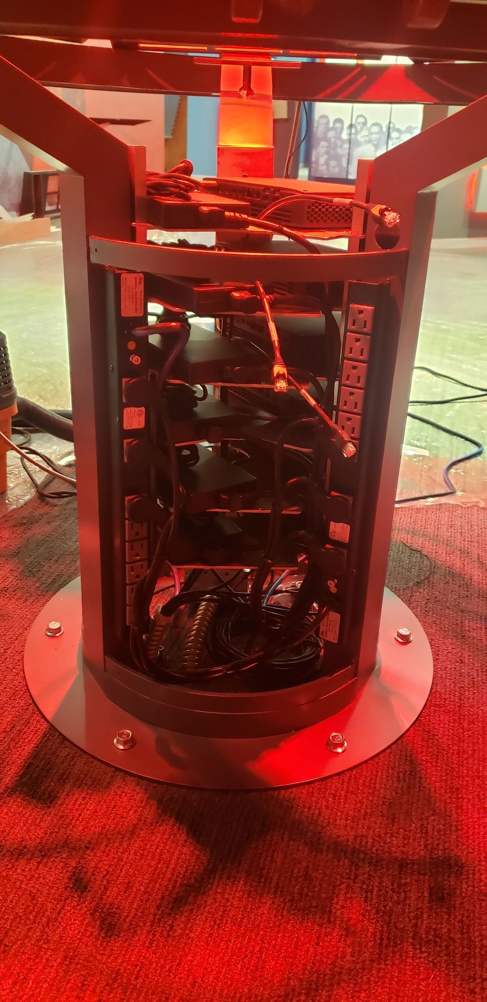 A machine is sitting on top of a red carpet.
