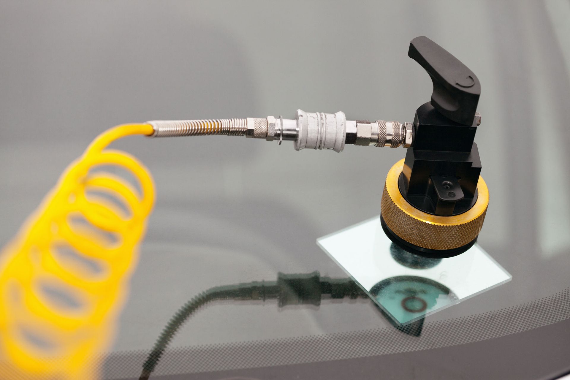 A Close-up Of a Tool on A Car Windshield | Perth, WA | Perth Windscreens and Autoglass