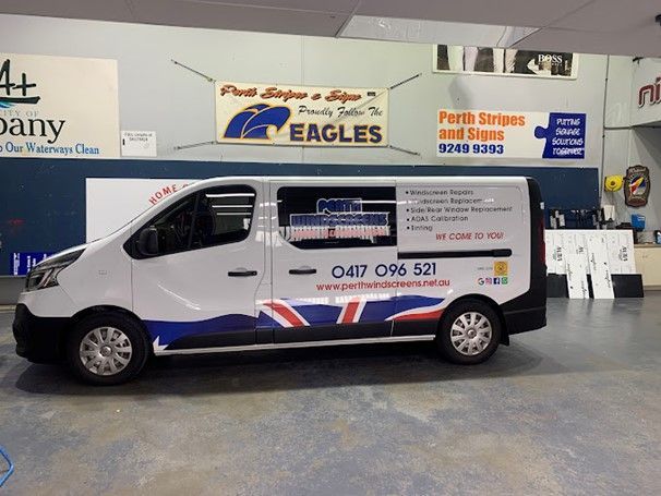 A White Van Is Parked in A Garage | Perth, WA | Perth Windscreens and Autoglass