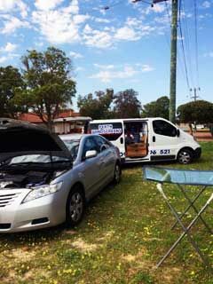 A Silver Car Is Parked Next to A White Van in A Grassy Field | Perth, WA | Perth Windscreens and Autoglass A Silver Car Is Parked Next to A White Van in A Grassy Field | Perth, WA | Perth Windscreens and Autoglass
