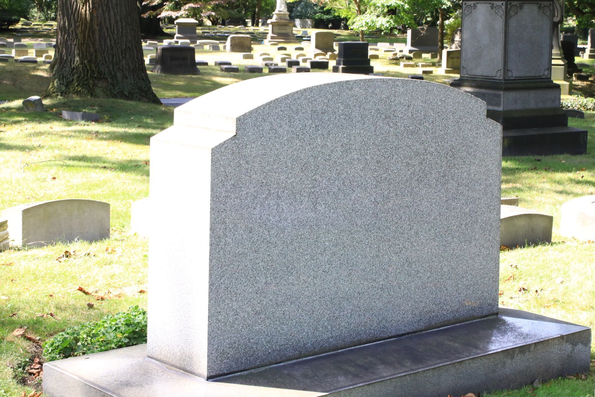 Plain gravestone at a cemetery.