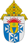 Heraldic shield with blue-and-white quartering, red rays, and a gold bishop’s mitre atop