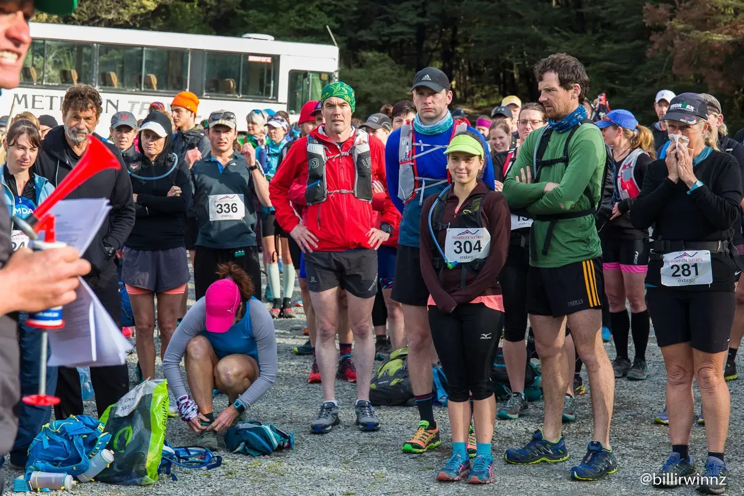 A group of people are standing in a line at a race.