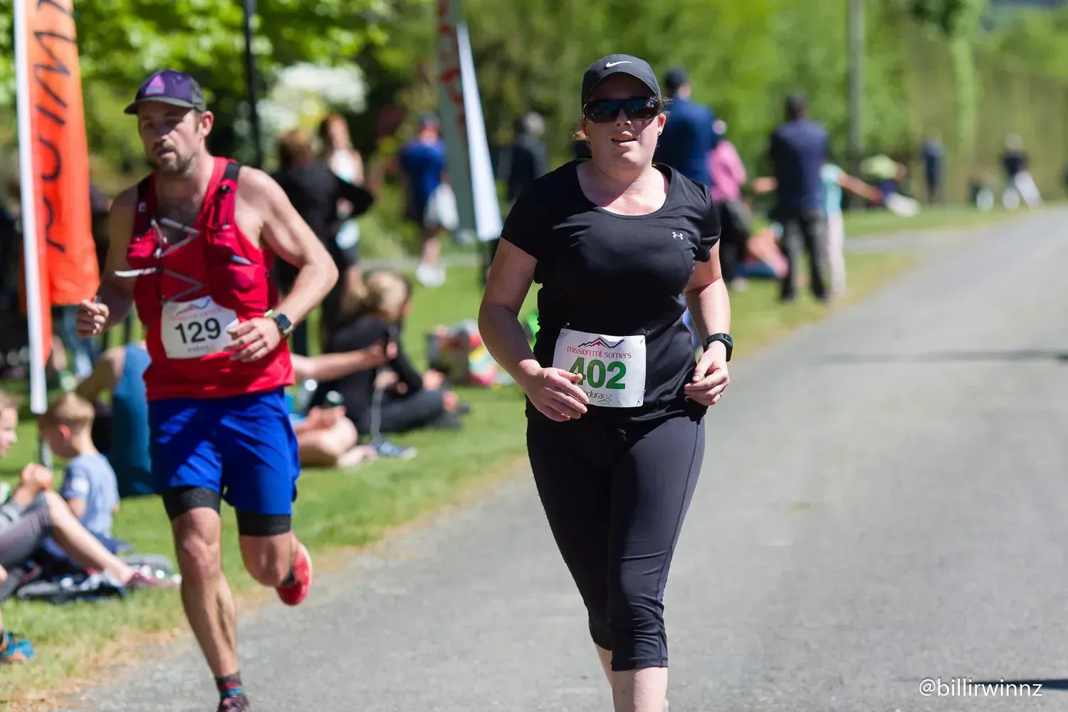 A man and a woman are running in a race.