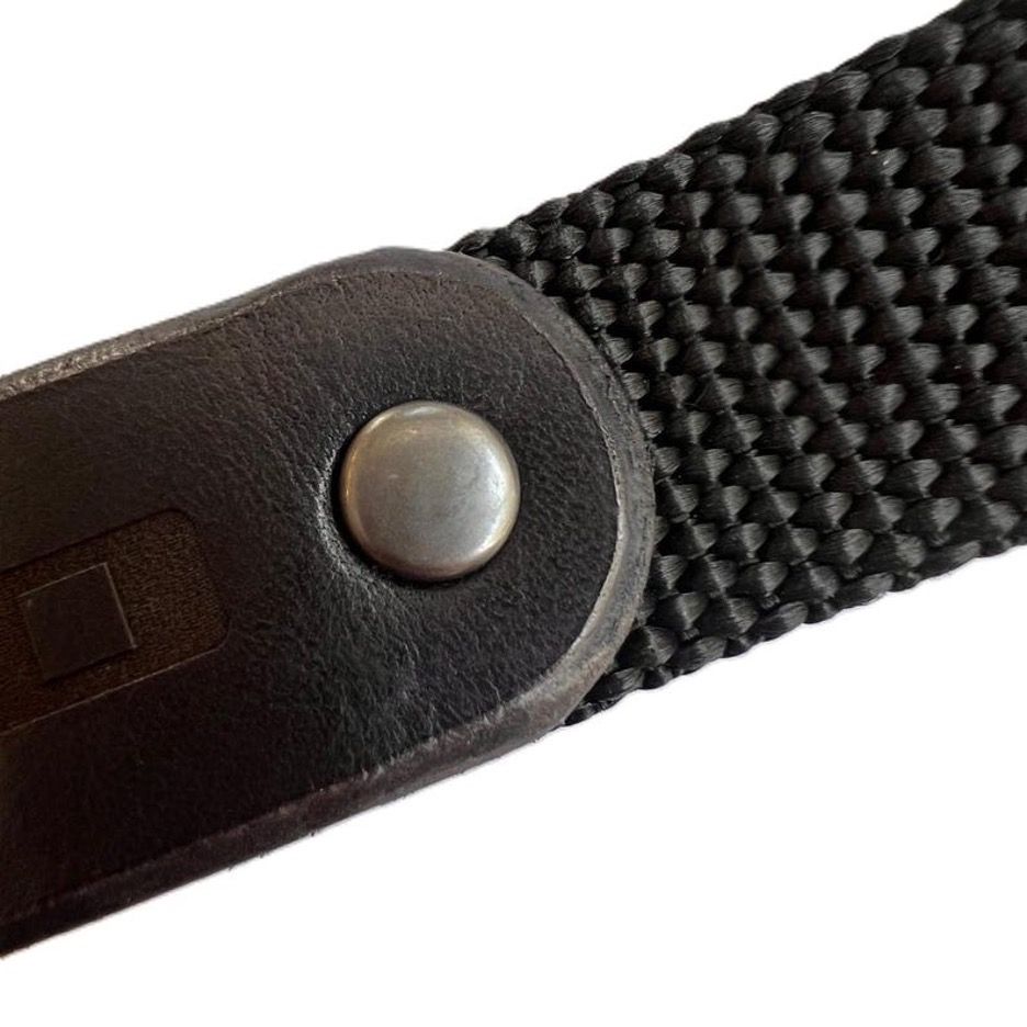 Black nylon strap with brown leather patch,