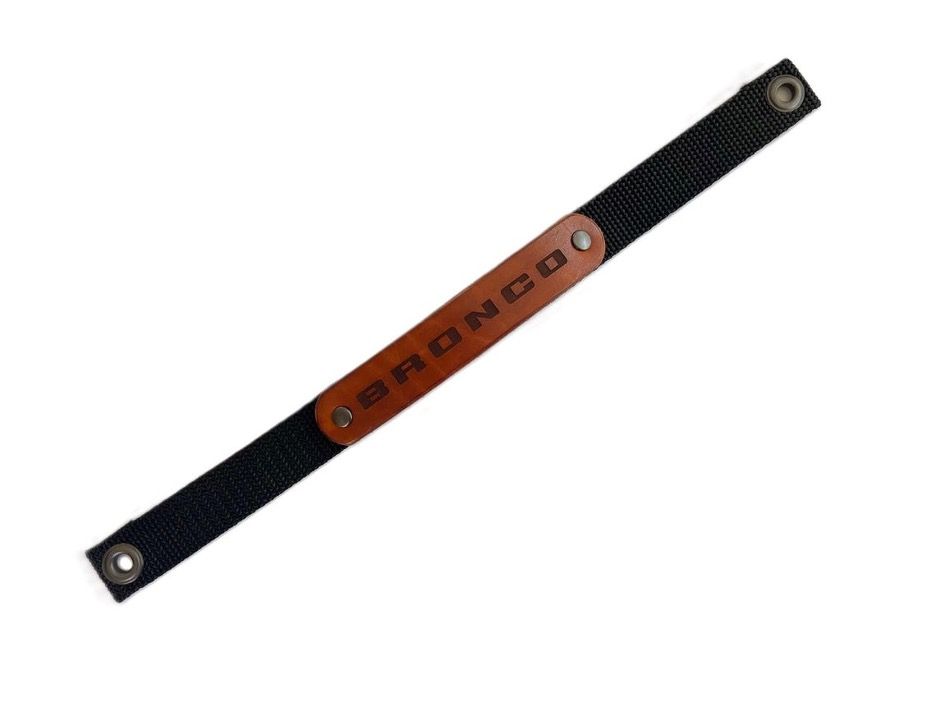 Black nylon strap with brown leather patch,