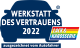 German award logo: “Werkstatt des Vertrauens 2022” with “Lack & Karosserie” in blue, red, yellow and white.
