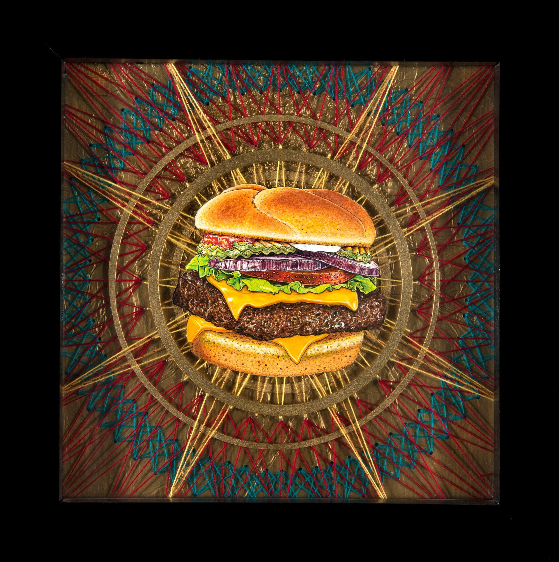 Art by Rich M Stevens. Stylized cheeseburger centered on a decorative radial mandala background
